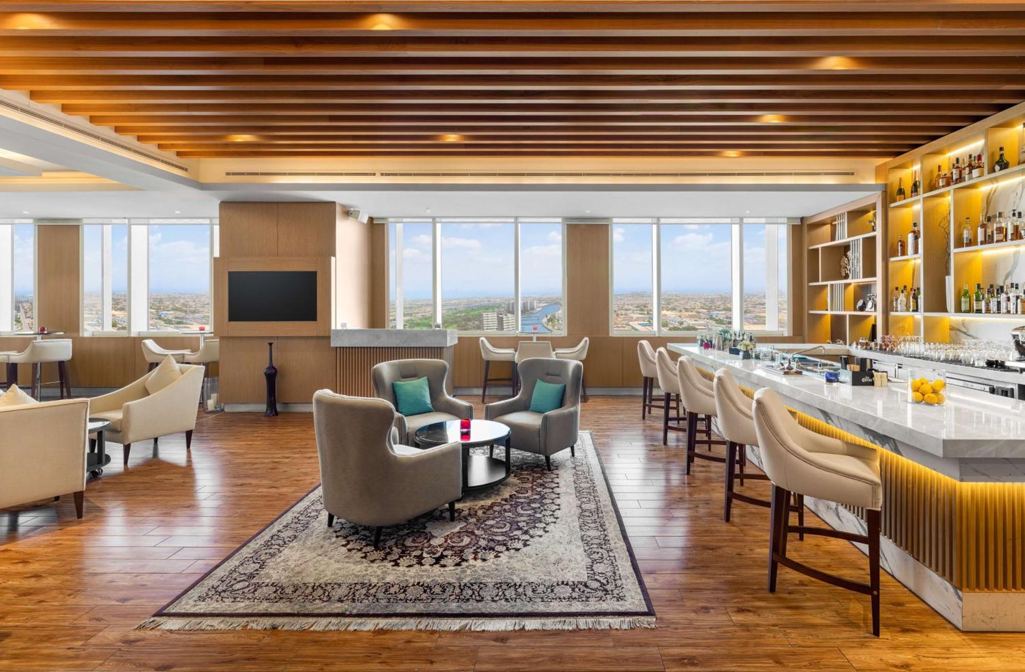 V 호텔 두바이, 큐리오 컬렉션 바이 힐튼 외부 사진 The Club Lounge at the hotel